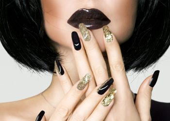 Portrait of beautiful brunette woman with elegant makeup and fashionable manicure.